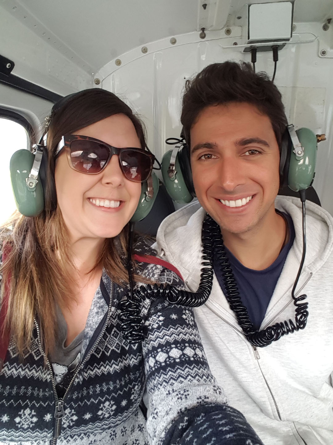 Lauren and Justin taking a helicopter tour in New Zealand