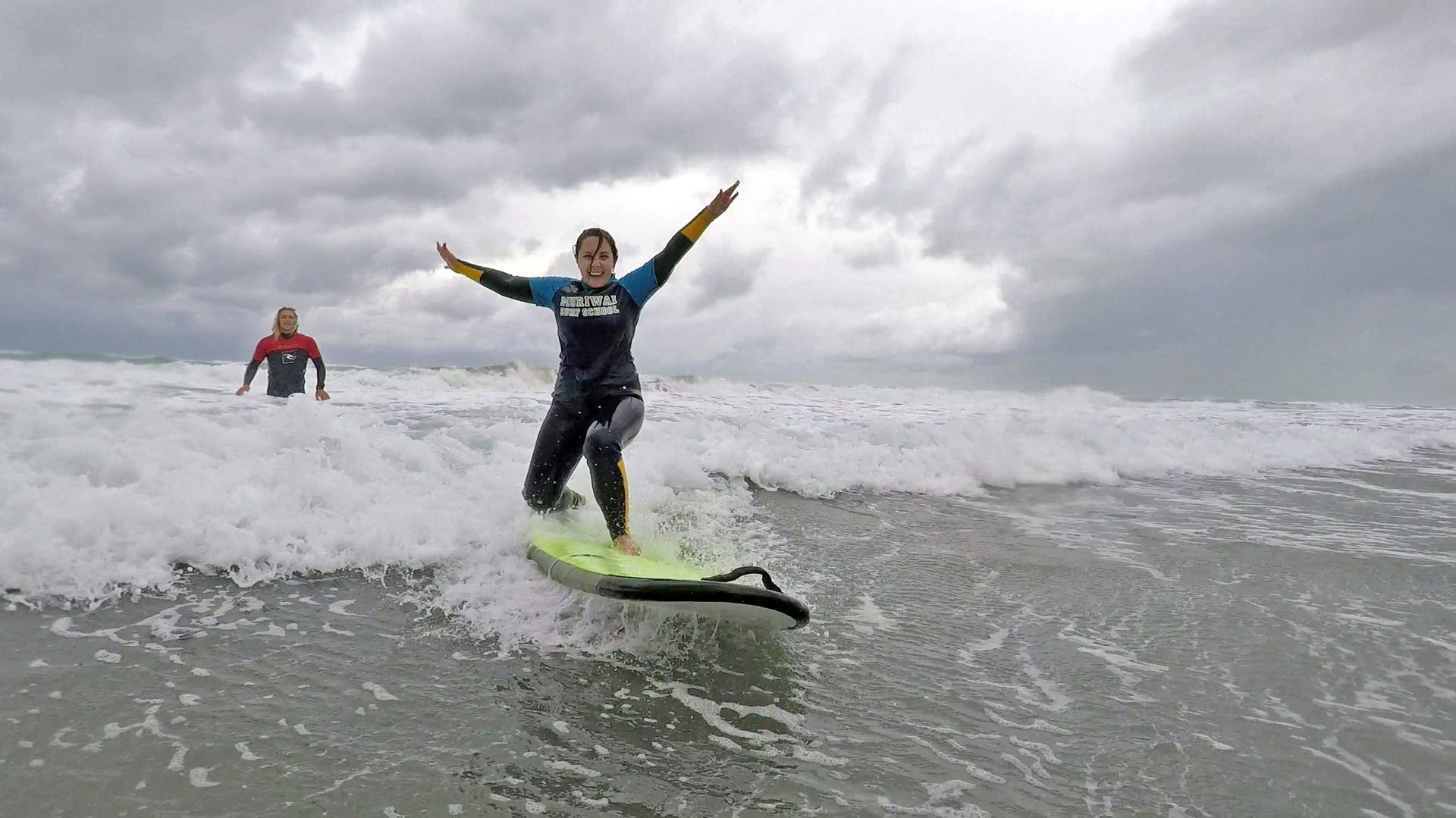 Surfing at Murawai Beach near Auckland