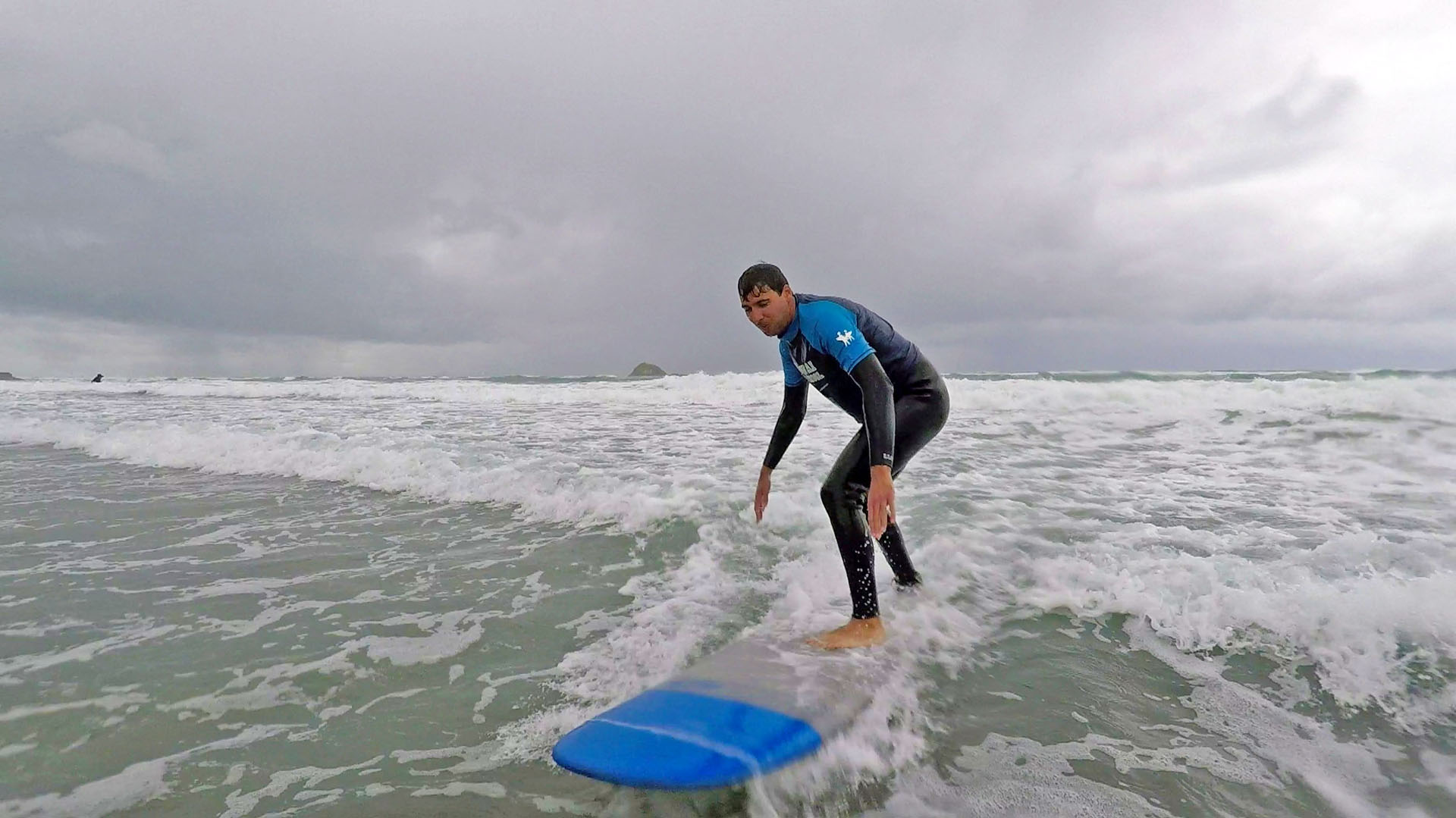 Surfing at Murawai Beach near Auckland