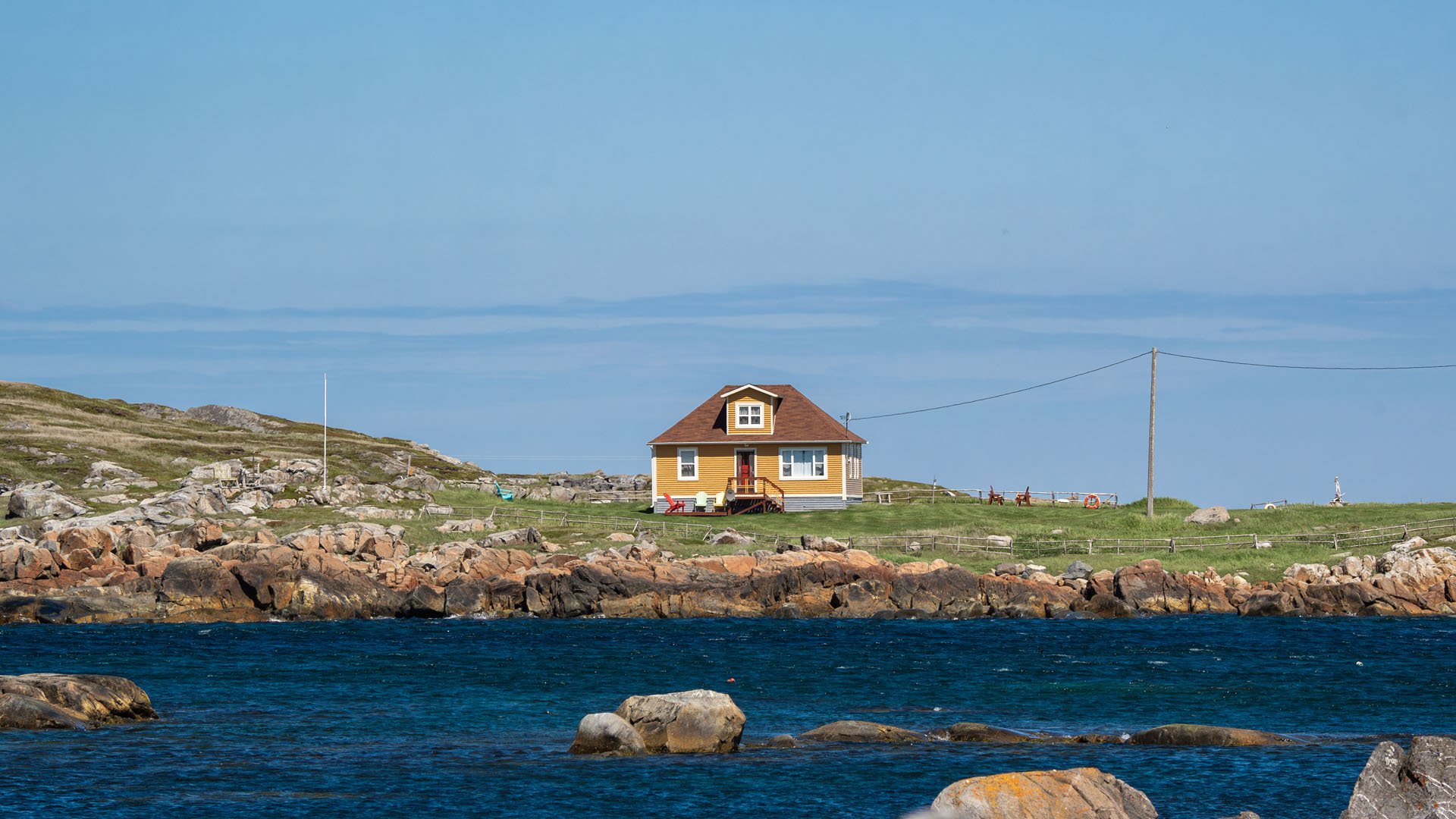 2024-FogoIsland182 Yellow house in Tilting